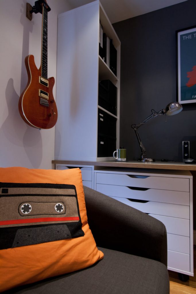 Retro Cushions and Guitar on wall