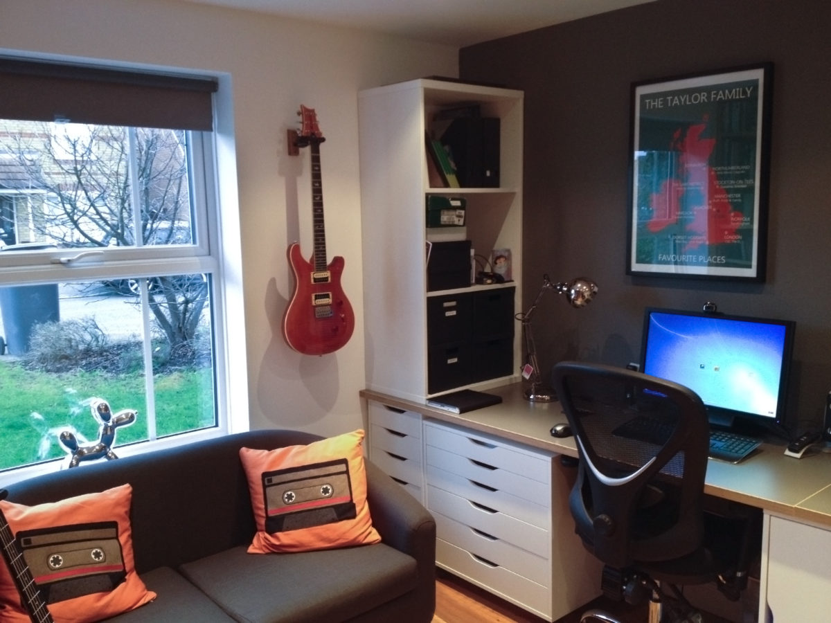 Corner of the DIY Ikea Hack Home Office / Study showing orange tape cushions
