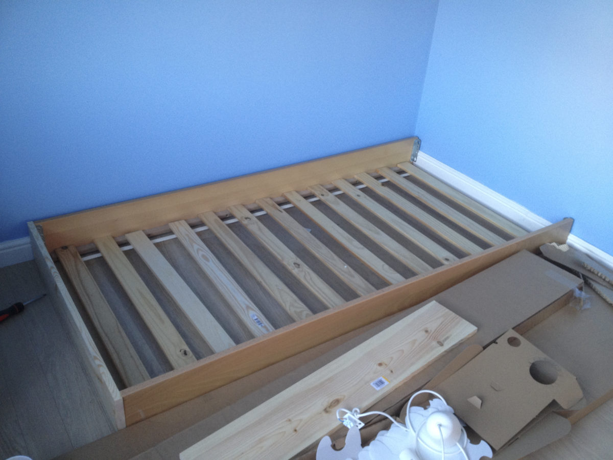 Emily's old bedframe with headboard and footboard removed and replaced with a
