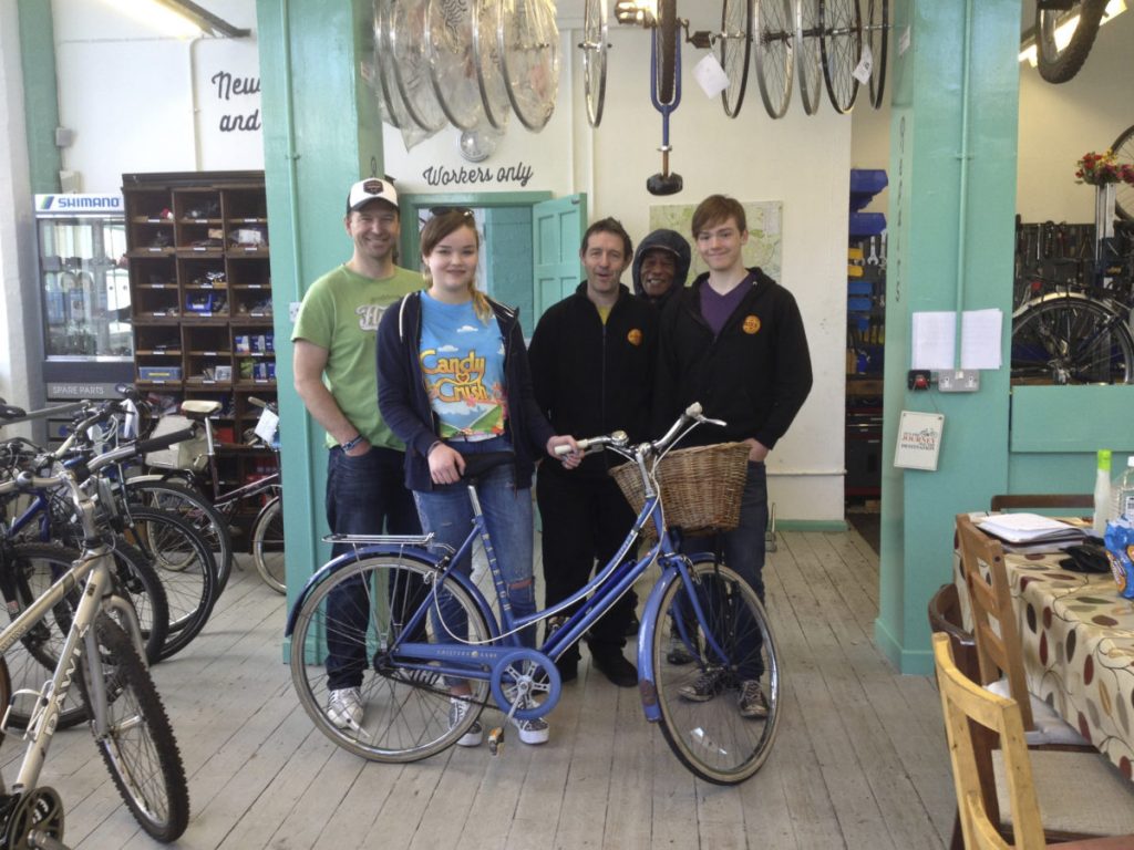 Beth, her bike and the staff at Nottingham Bike Works