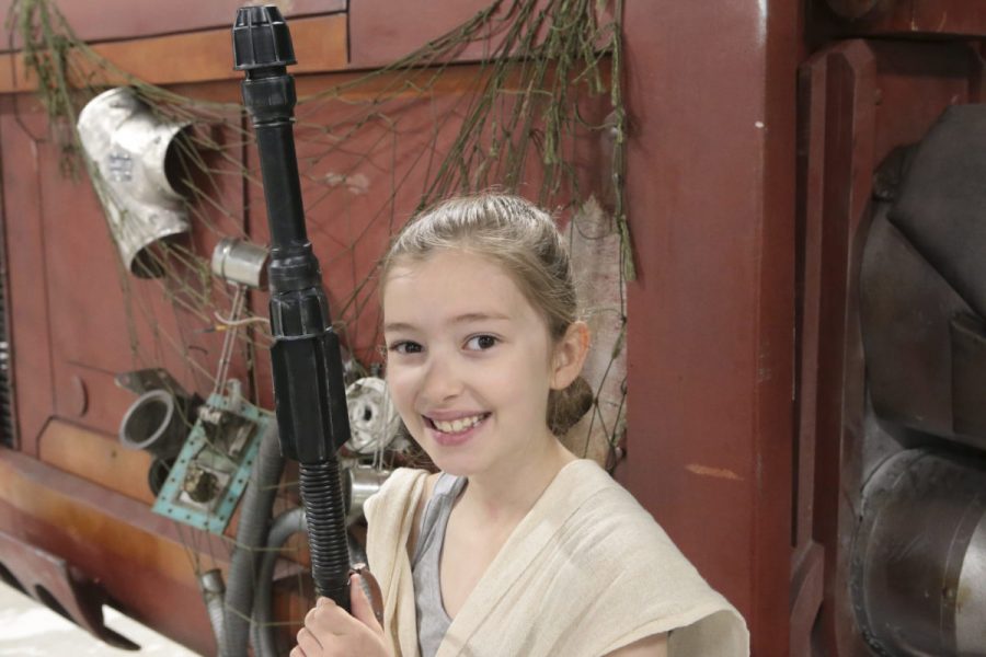 DIY Star Wars Rey Costume Emily stands in front of Rey's Speeder