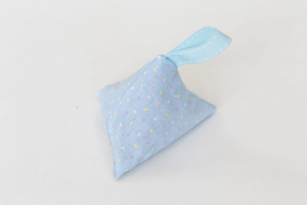 The pyramid lavender bag in blue material with spots , complete with blue looped ribbon tag is finished.
