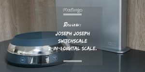 Joseph Joseph SwitchScale 2-in-1 Digital Scale Review Text Overlay With scale in foreground with bowl facing downwards and chopping boards in background