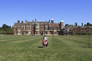 Richard, Beth and Emily standing in front of Sandringham Palace, Norfolk