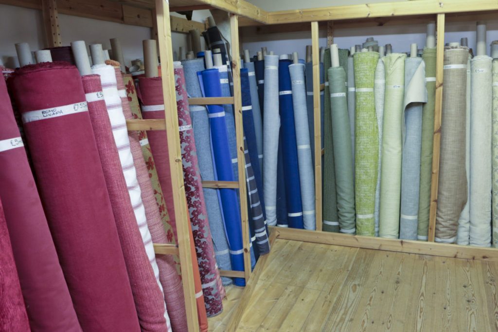 Downstairs in Bargain Fabrics, Castle Donington. Bargain fabric by the metre - rolls and rolls of it.