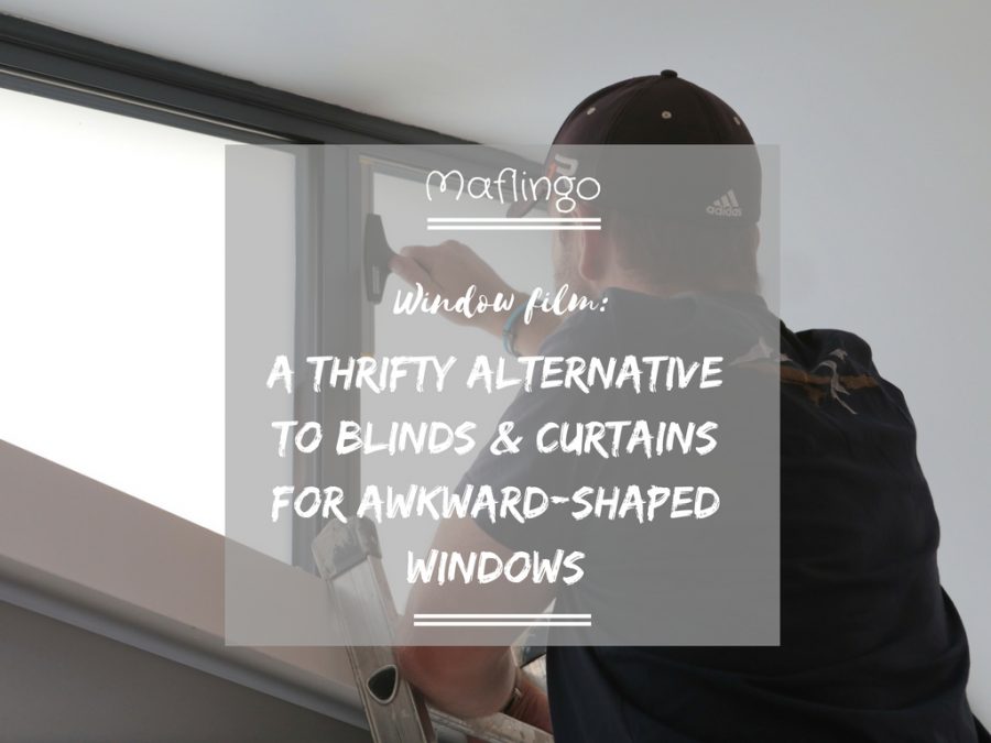 Window film, a thrifty alternative to blinds and curtains for awkward shaped windows overlay with Mr T applying window film with a squeegee.