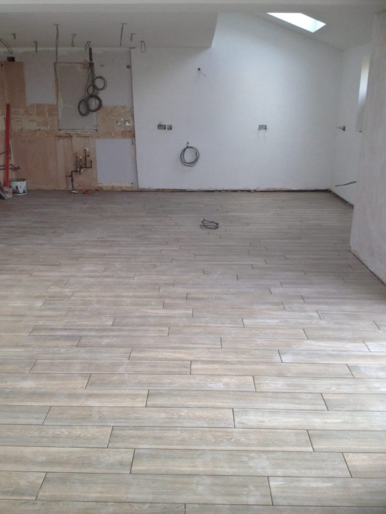 Our beautiful Vintage Ash Porcelain floor tiles stretch from wall to wall, ready for our new kitchen.
