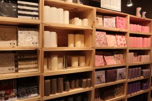 Shelves filled with candles and napkins