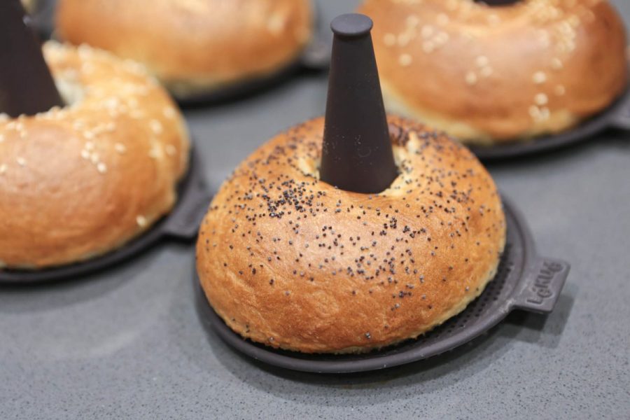 Close-up of The golden brown, crispy sesame and poppy seed bagels on Lékué silicone bagel moulds