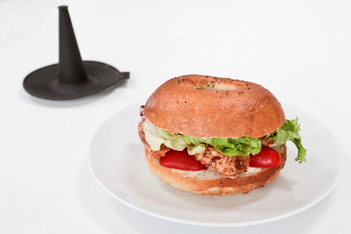 A poppy seed bagel sandwich made with a Lékué silicone bagel moulds